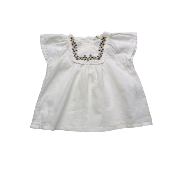 Blouse blanche à col fleuri