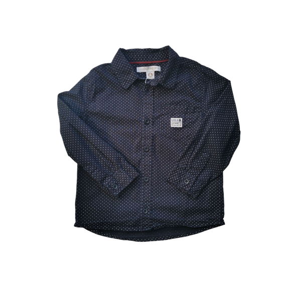 Chemise bleue à pois blancs