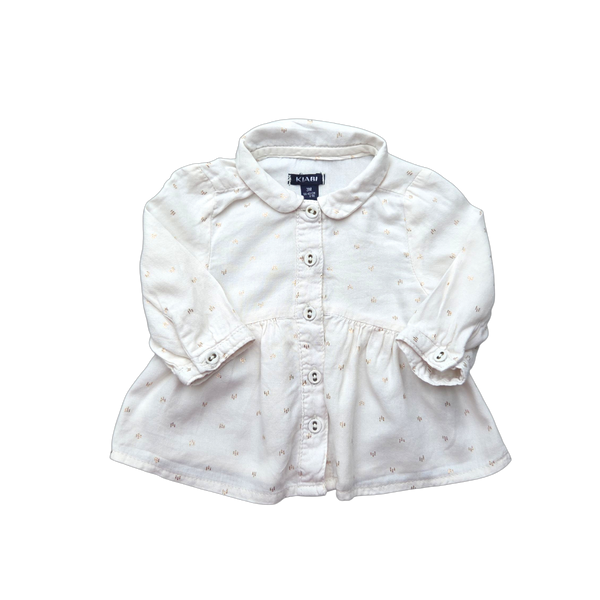 Blouse beige à motifs dorés